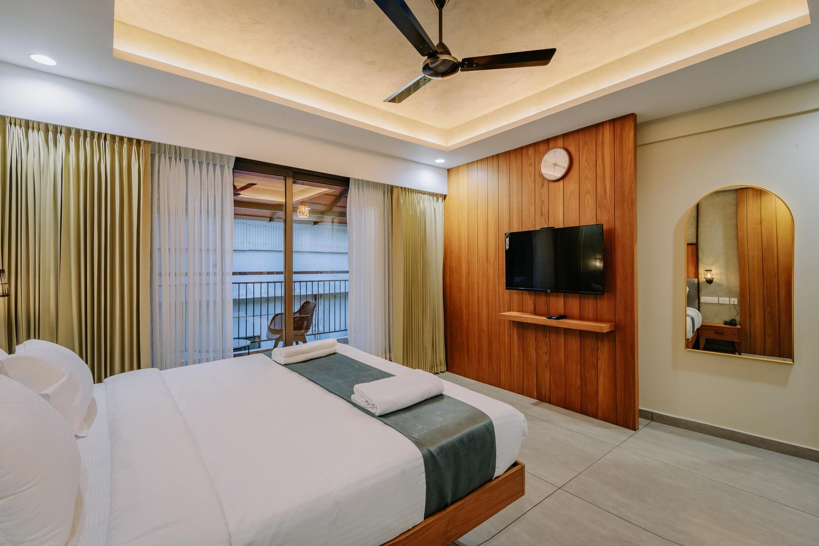 Bedroom with Wood-Panelled TV Wall