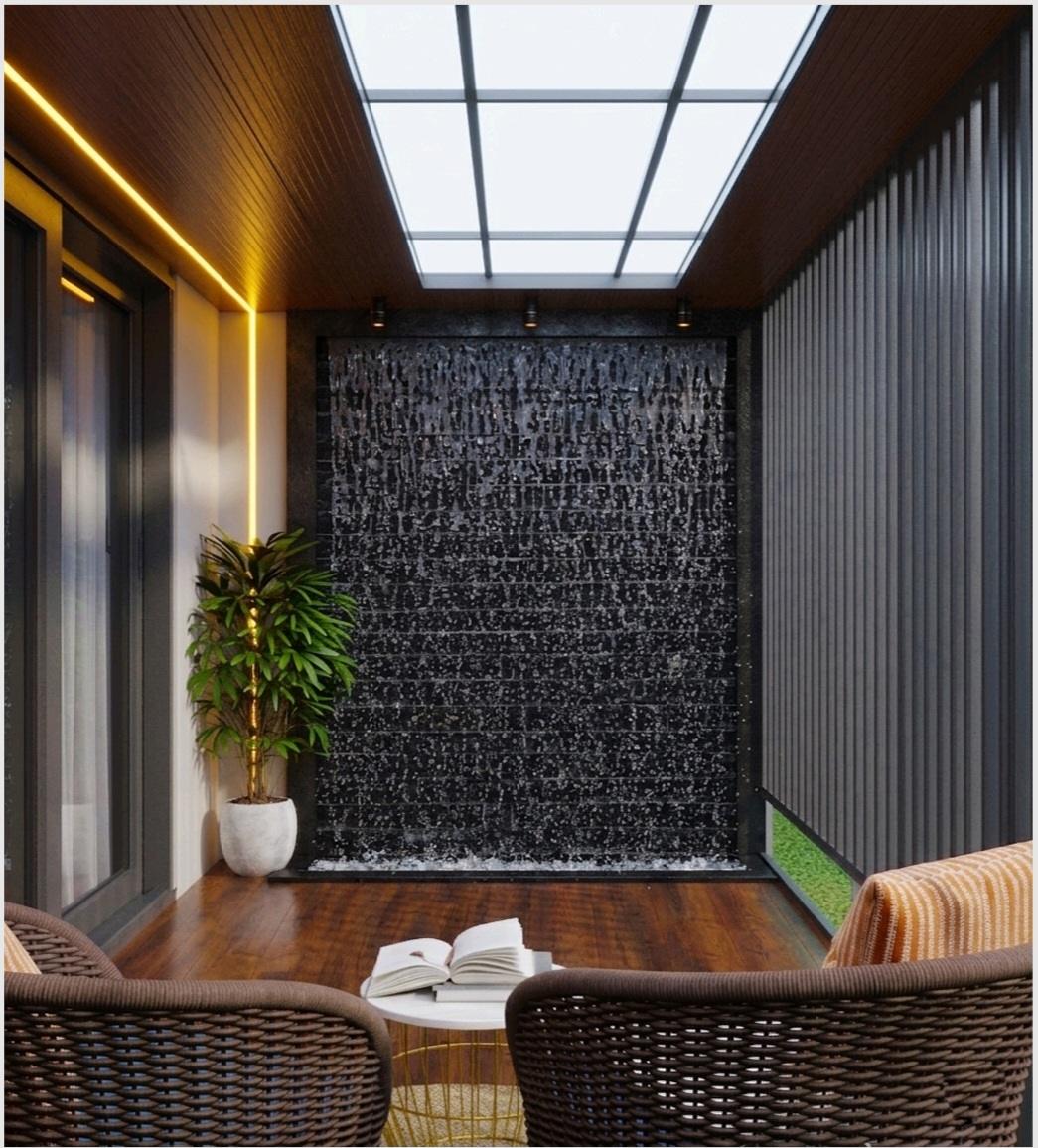 Skylit courtyard with stone water wall